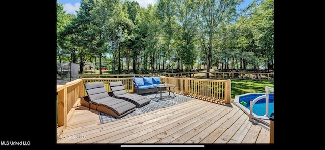 11368 Cedar Point Cv, Hernando, MS 38632 - wooden terrace with a fenced backyard, an outdoor living space, and an outdoor pool