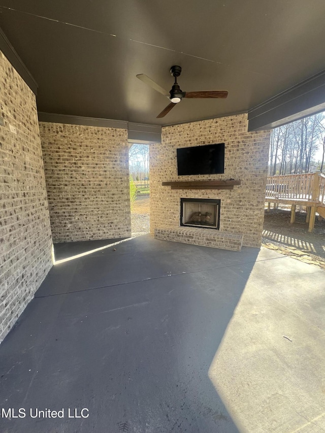 11368 Cedar Point Cv, Hernando, MS 38632 - view of patio with an outdoor brick fireplace and ceiling fan