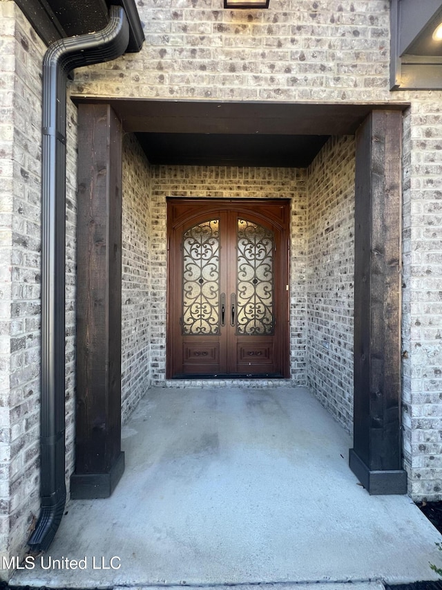 11368 Cedar Point Cv, Hernando, MS 38632 - property entrance featuring brick siding and french doors