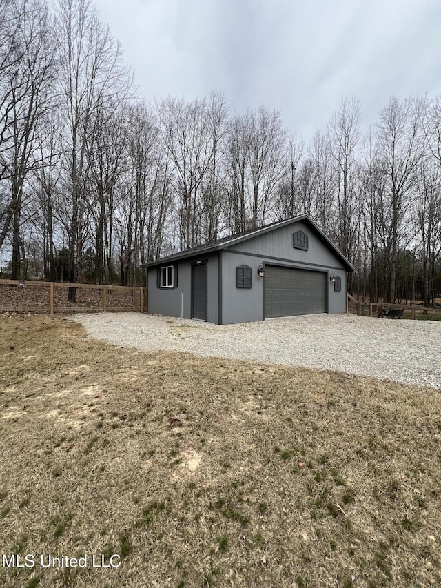 11368 Cedar Point Cv, Hernando, MS 38632 - view of home's exterior featuring an outbuilding and view of scattered trees