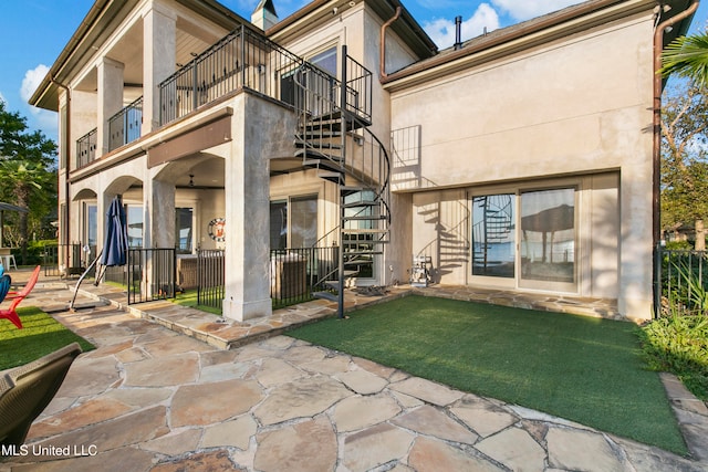 back of house with a patio and a balcony