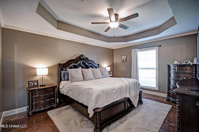 862 Willow Grande Cir, Brandon, MS 39047 - bedroom featuring a tray ceiling, baseboards, tile patterned flooring, ceiling fan, and crown molding