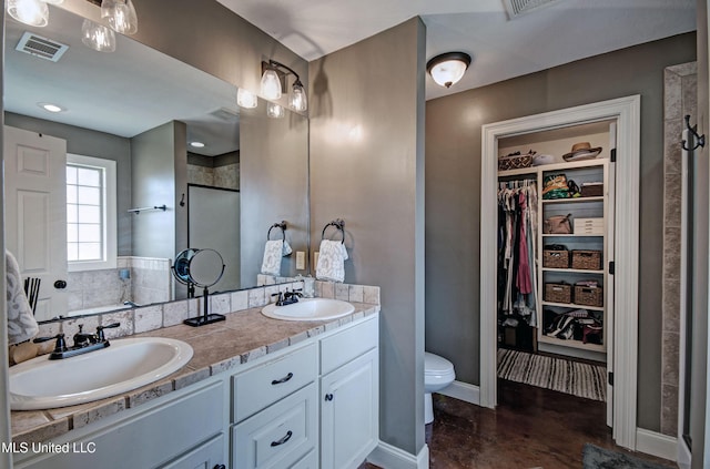 862 Willow Grande Cir, Brandon, MS 39047 - full bath featuring a spacious closet, toilet, double vanity, a shower stall, and baseboards