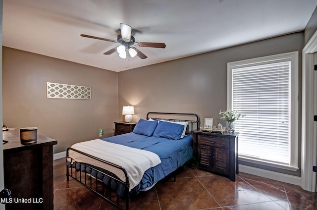 862 Willow Grande Cir, Brandon, MS 39047 - bedroom with baseboards, dark tile patterned flooring, and ceiling fan