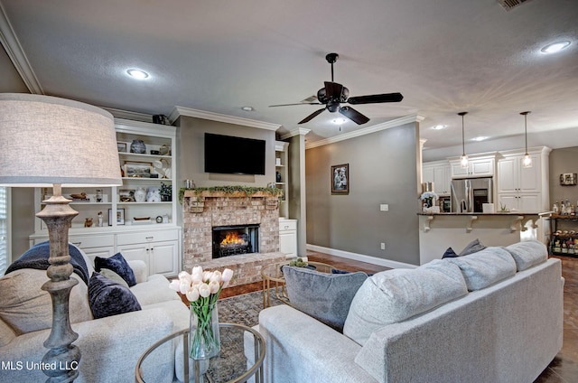 862 Willow Grande Cir, Brandon, MS 39047 - living area featuring baseboards, a ceiling fan, ornamental molding, recessed lighting, and a fireplace