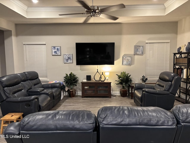10645 Chapelwood Dr, Gulfport, MS 39503 - living area featuring crown molding, baseboards, a tray ceiling, wood finished floors, and a ceiling fan