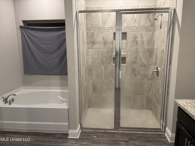 10645 Chapelwood Dr, Gulfport, MS 39503 - full bath with vanity, a shower stall, a bath, and wood finished floors