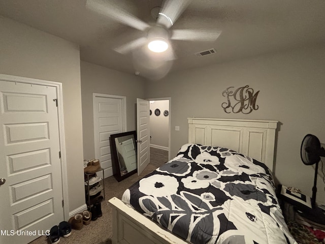 10645 Chapelwood Dr, Gulfport, MS 39503 - bedroom featuring a ceiling fan, visible vents, dark carpet, and baseboards