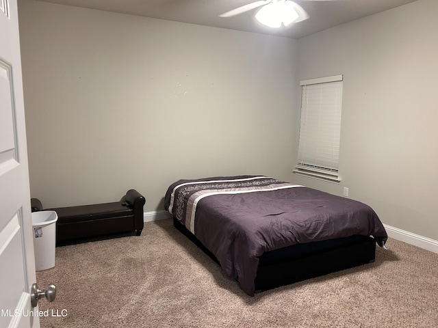 10645 Chapelwood Dr, Gulfport, MS 39503 - carpeted bedroom featuring baseboards and ceiling fan