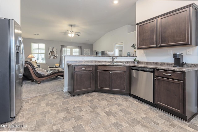 kitchen featuring dark brown cabinetry, sink, and appliances with stainless steel finishes