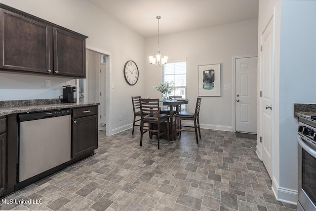 kitchen with appliances with stainless steel finishes, hanging light fixtures, dark brown cabinets, dark stone counters, and a chandelier