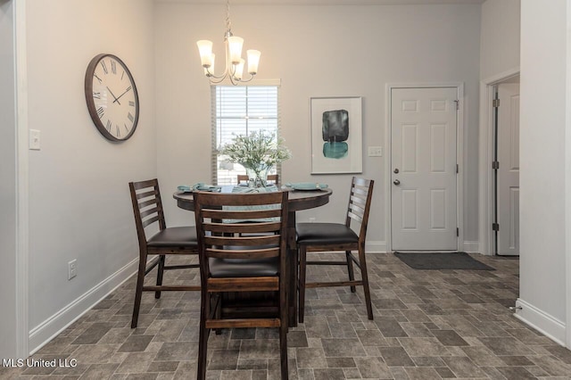 dining space with a notable chandelier