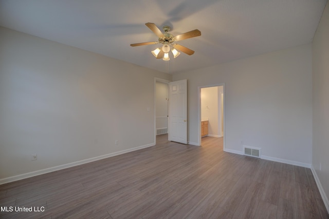 unfurnished room with light hardwood / wood-style floors and ceiling fan