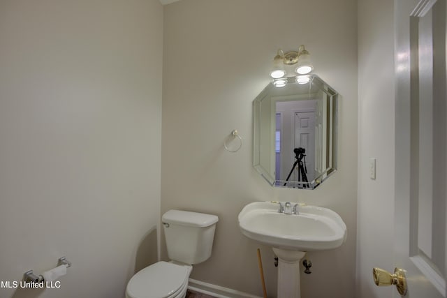 bathroom featuring sink and toilet