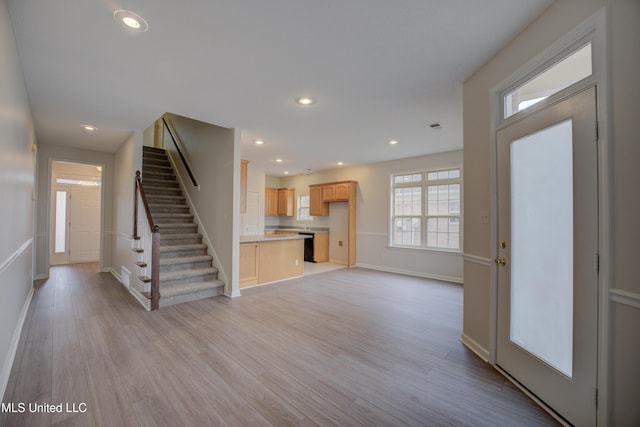 unfurnished living room featuring light wood-type flooring