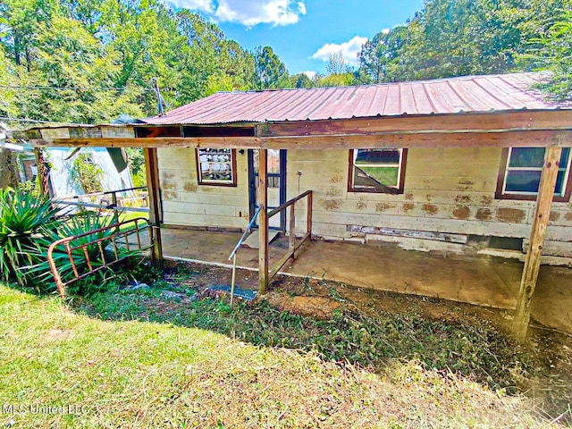 view of outbuilding featuring a yard