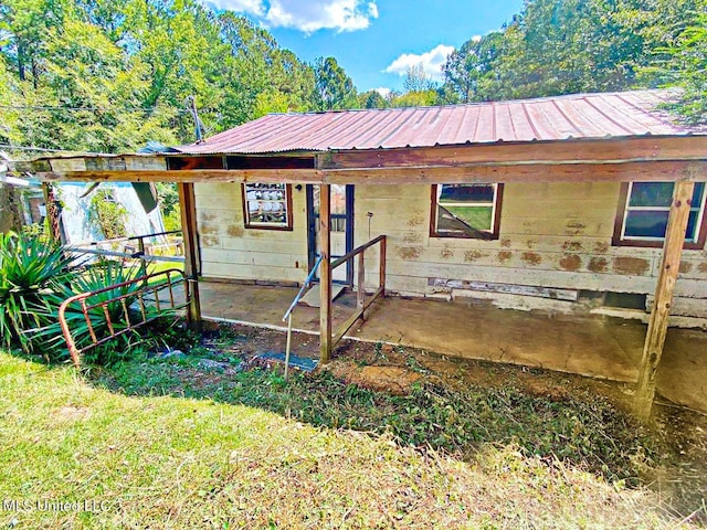 exterior space with metal roof