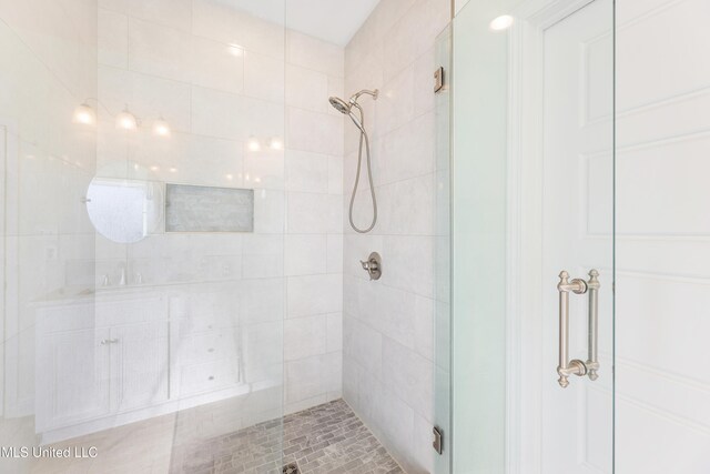 full bathroom with a shower stall