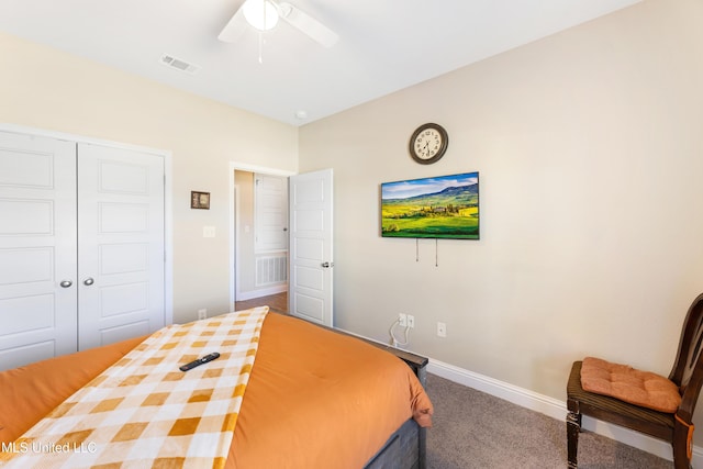 bedroom featuring baseboards, visible vents, a ceiling fan, carpet floors, and a closet