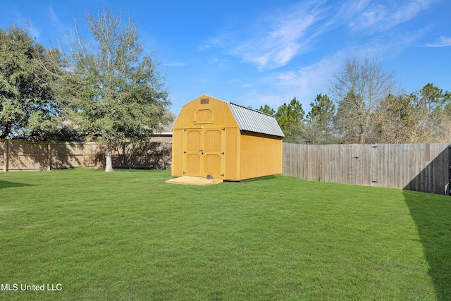 view of yard featuring a fenced backyard, an outdoor structure, and a storage shed