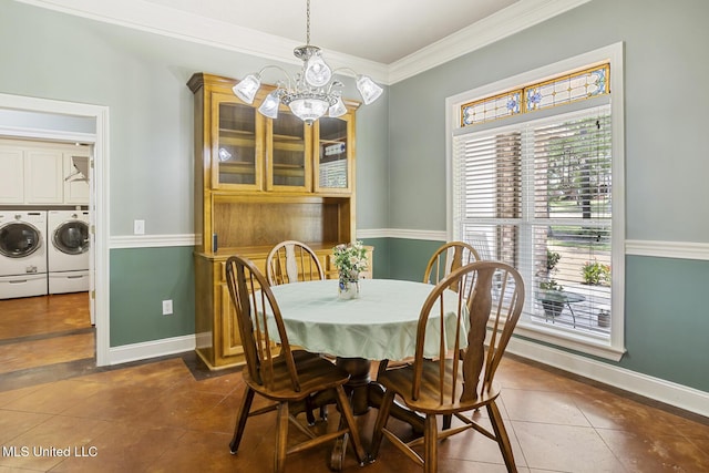 114 Sandstone Dr, Brandon, MS 39047 - dining area featuring separate washer and dryer, a chandelier, dark tile patterned flooring, plenty of natural light, and ornamental molding