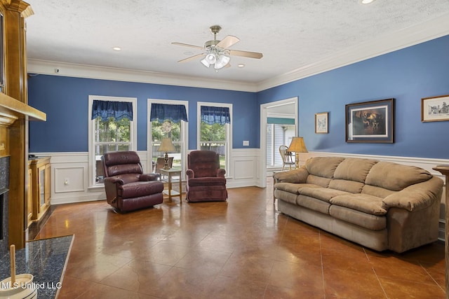 114 Sandstone Dr, Brandon, MS 39047 - living room with a ceiling fan, a premium fireplace, a textured ceiling, tile patterned floors, and crown molding