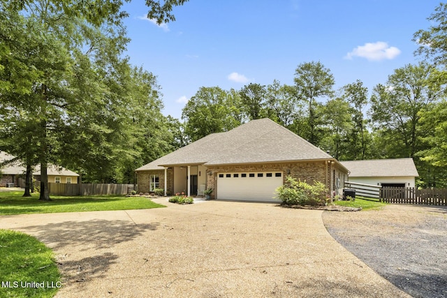 114 Sandstone Dr, Brandon, MS 39047 - view of front facade featuring driveway, a garage, brick siding, and a shingled roof