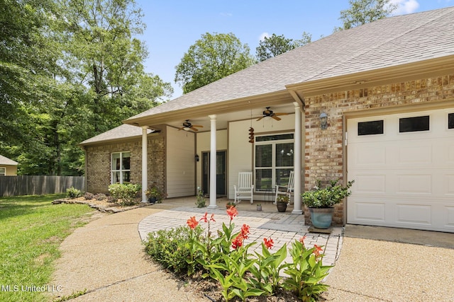 114 Sandstone Dr, Brandon, MS 39047 - property entrance featuring brick siding, ceiling fan, and roof with shingles