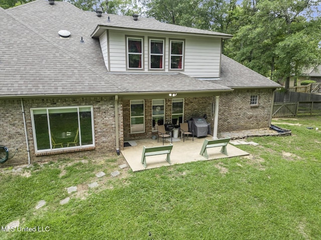 114 Sandstone Dr, Brandon, MS 39047 - back of property with brick siding, a patio area, and roof with shingles