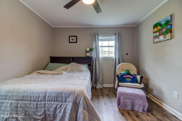 bedroom with crown molding, hardwood / wood-style flooring, and ceiling fan