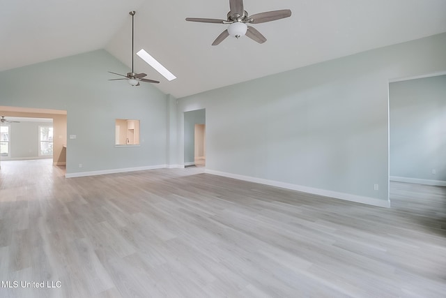 unfurnished living room with a skylight, ceiling fan, high vaulted ceiling, and light wood-type flooring