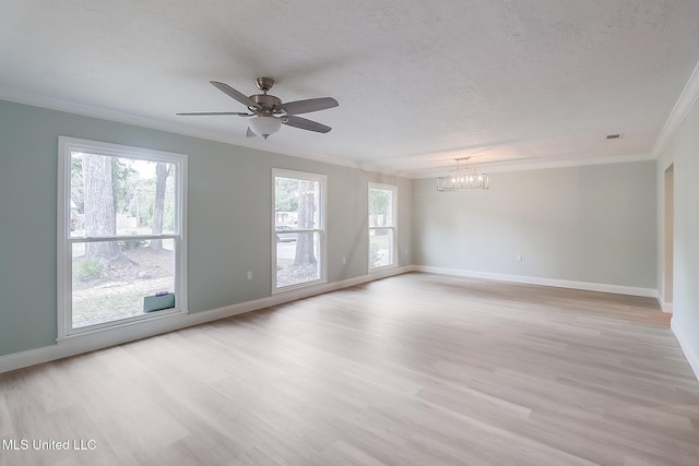 spare room with a textured ceiling, light hardwood / wood-style flooring, ceiling fan with notable chandelier, and ornamental molding