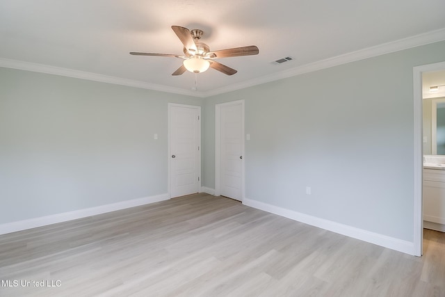 spare room with crown molding, ceiling fan, and light hardwood / wood-style floors