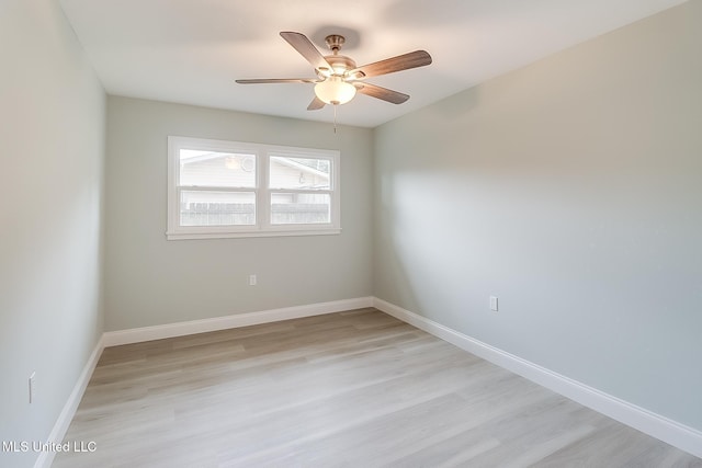 spare room featuring ceiling fan and light hardwood / wood-style floors