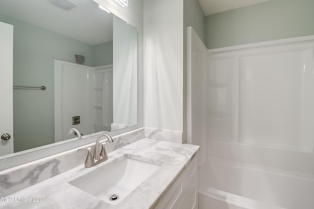 bathroom with vanity and shower / tub combination