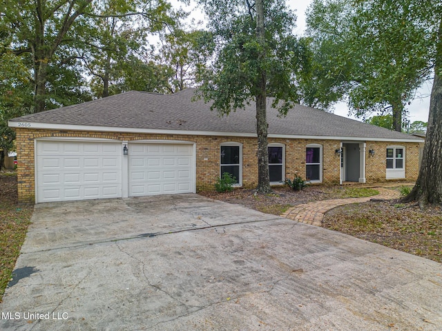 ranch-style home featuring a garage