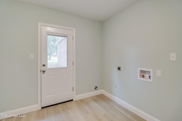 clothes washing area featuring hookup for an electric dryer, hookup for a washing machine, and light wood-type flooring