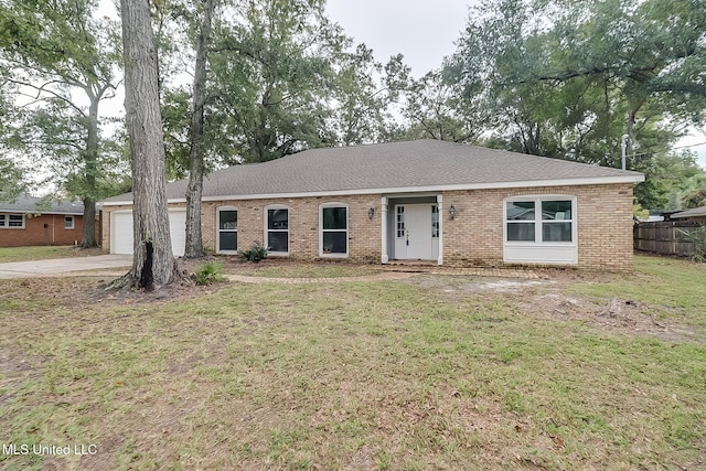 ranch-style home with a front lawn and a garage