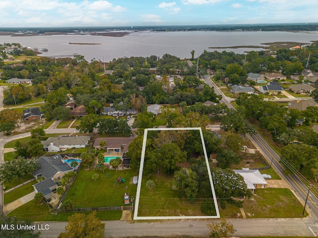 birds eye view of property with a water view