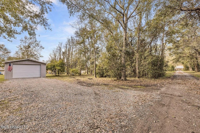 exterior space featuring an outbuilding and a garage
