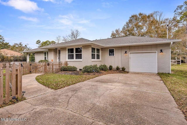 single story home with a garage and a front lawn