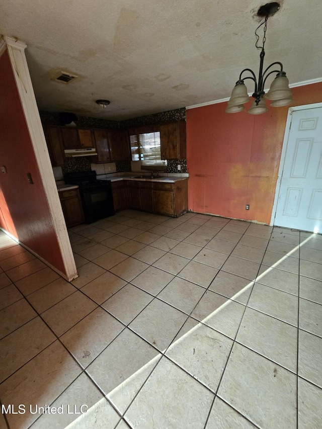 kitchen featuring black electric range oven, sink, decorative light fixtures, a notable chandelier, and extractor fan