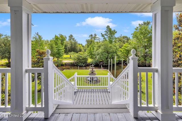 11020 Jordan Dr, Bay Saint Louis, MS 39520 - wooden terrace with a water view, a yard, and view of scattered trees
