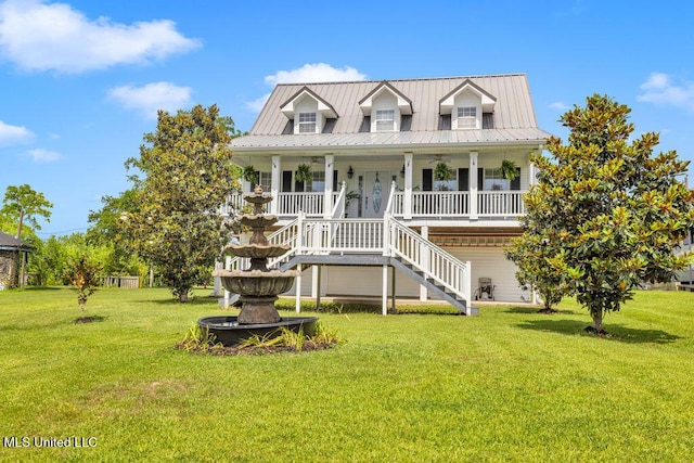 11020 Jordan Dr, Bay Saint Louis, MS 39520 - view of front of house with a front lawn, covered porch, metal roof, and stairway