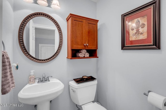 11020 Jordan Dr, Bay Saint Louis, MS 39520 - half bathroom featuring a sink and toilet