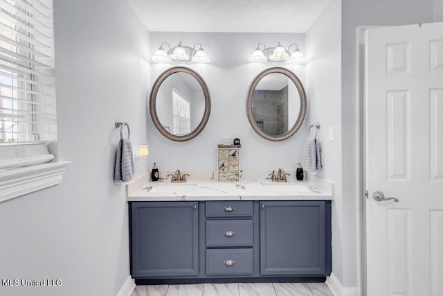 11020 Jordan Dr, Bay Saint Louis, MS 39520 - bathroom with double vanity and baseboards