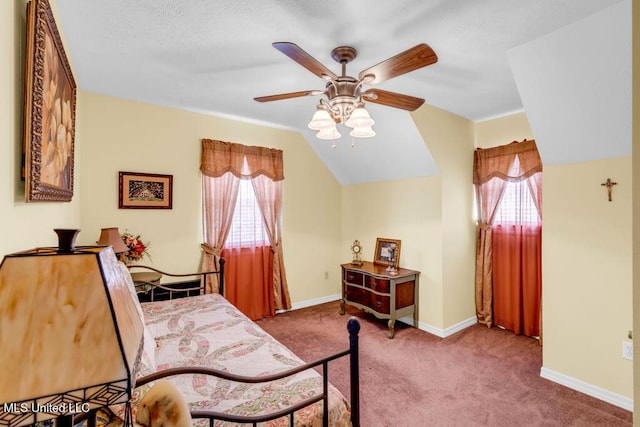 11020 Jordan Dr, Bay Saint Louis, MS 39520 - carpeted bedroom with lofted ceiling, baseboards, and a ceiling fan