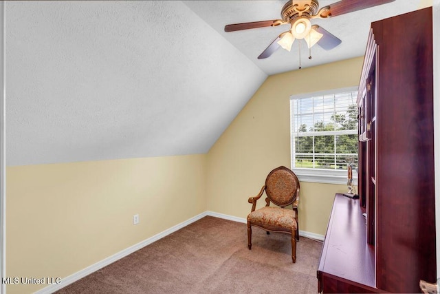 11020 Jordan Dr, Bay Saint Louis, MS 39520 - sitting room featuring lofted ceiling, carpet, baseboards, a textured ceiling, and ceiling fan