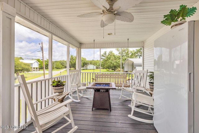 11020 Jordan Dr, Bay Saint Louis, MS 39520 - sunroom / solarium featuring a fire pit and ceiling fan