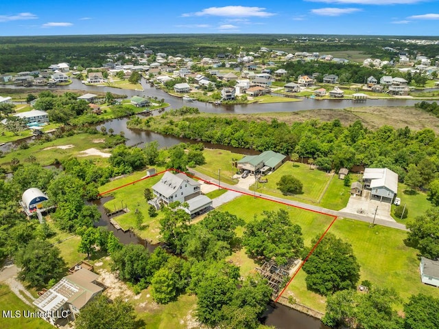 11020 Jordan Dr, Bay Saint Louis, MS 39520 - aerial view of residential area featuring property parcel outlined and a nearby body of water